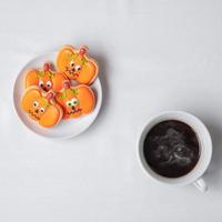 hot coffee cup with funny Halloween Cookies. Happy Halloween day, Trick or Threat, Hello October, fall autumn, Traditional, party and holiday concept photo