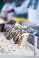 Japanese Fishes grilling, Delicious traditional food in Arashiyama, Kyoto, Japan. Asia travel and Street food concept photo