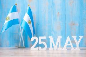 Wooden text of May 25th with Argentina flags. Argentina Revolution day and happy celebration concepts photo