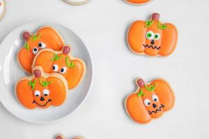 Happy Halloween day with funny Cookies, different Pumpkin biscuits on plate. Trick or Threat, Hello October, fall autumn, Traditional, party and holiday concept photo