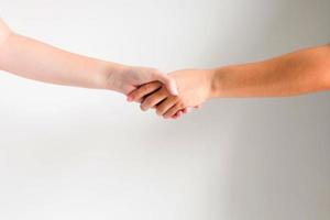 Two peoples is shaking hands. photo