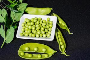 a stack of green sweet peas Pisum sativum photo