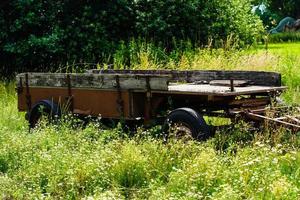an abandoned and forgotten old agricultural utility vehicle in the old country of Hamburg photo