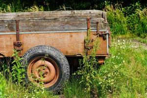 an abandoned and forgotten old agricultural utility vehicle in the old country of Hamburg photo