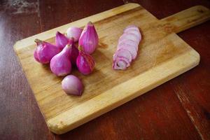 Sliced of organic red onions on Wooden background. Pro photo