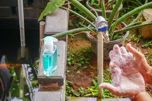 washing hands under the water tap. Hygiene concept hand detail. Pro photo