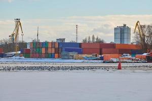 Harbor cranes, container ship terminal, cargo container yard photo