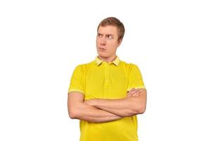 Suspicious man crossed arms on his chest, proud look isolated white background, disappointed emotion photo