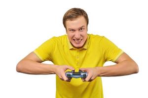 Funny handsome gamer with gamepad, excited video game player isolated on white background photo