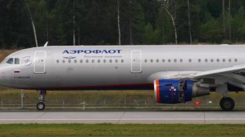 MOSCOW, RUSSIAN FEDERATION JULY 29, 2021 - Airbus A321 of Aeroflot braking after landing at Sheremetyevo airport SVO. Airplane arrival, side view video