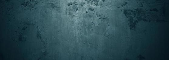 Brush scratches on the wall. Scary dark walls, slightly light black concrete cement texture for background. photo