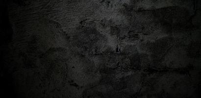 Dark grey black cement for background. Black stone concrete texture background photo