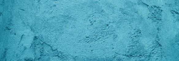 hermoso fondo azul, textura de pared antigua, fondo enlucido azul. muro de hormigón azul claro foto