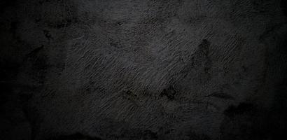 Dark grey black cement for background. Black stone concrete texture background photo