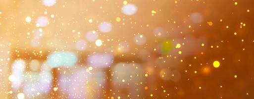 Abstract Christmas glitter lights background. Blured Christmas and New Year light. photo