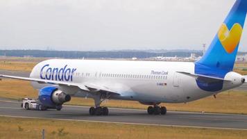 FRANKFURT AM MAIN, GERMANY JULY 21, 2017 - Condor Thomas Cook Boeing 767 D ABUC towing by tractor to service. Fraport, Frankfurt, Germany video