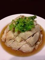 Close up of Drunken Hainanese Chicken, chinese style food, isolated on dark background photo