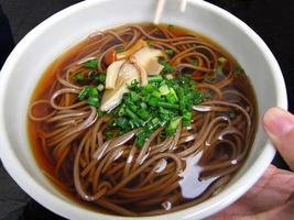 close-up Japanese hot soup buckweed noodle shoyu soba local menu in japan photo