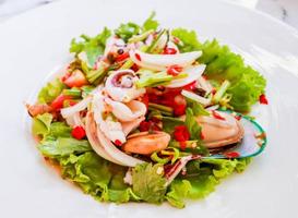 Closeup Thai spicy and sour seafood salad photo