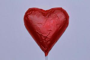 Chocolate heart on a white background. photo