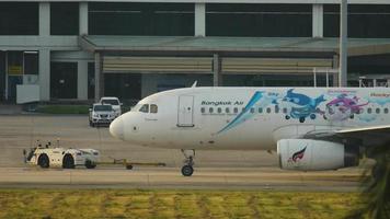 PHUKET, THAILAND NOVEMBER 26, 2016 - Bangkok Airways Airbus 320 HS PPE named Mahamongkol before departure. video