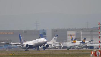 FRANKFURT AM MAIN, GERMANY JULY 17, 2017 - United Airlines Boeing 777 departure at runway 25C. Fraport, Frankfurt, Germany video