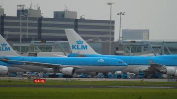 AMSTERDAM, THE NETHERLANDS JULY 26, 2017 - KLM Airbus 330 PH AOA towing by tractor to service. Shiphol Arport, Amsterdam, Holland video