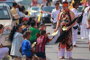 Korat, THAILAND - OCTOBER 27 Unidentified devotee of Vegetarian Festival, person who invites the spirits of gods to possess their bodies on October 16, 2015  in Korat, Thailand photo