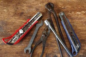 Old tools on a wooden table photo