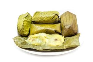 sticky rice covered in banana leaf photo