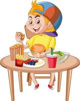 un niño comiendo en la mesa vector