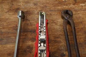 Old tools on a wooden table photo