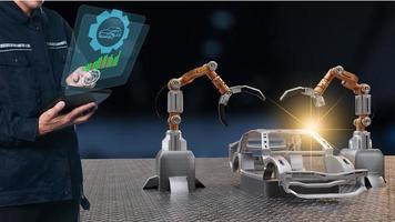 Asian Man mechanic inspection Car production processing service in factory robot hi tech robotic AI control arm hand robot artificial for car technology in garage dealership with tech hand cyborg 2022 photo