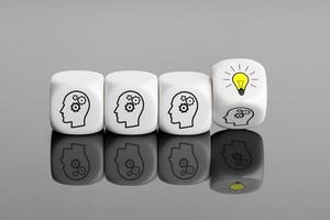 Creative idea or innovative idea development concept. Group Brainstorming process. White blocks with gear head icon and light bulb on flipping block photo