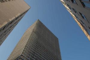 Building with scaffolding and protective sheets photo