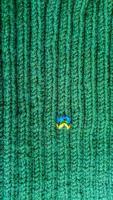 Handmade balaclava with Ukrainian symbols. Knitted from gray and green threads. Warms, reliably saves from the cold. photo