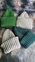 Handmade balaclava with Ukrainian symbols. Knitted from gray and green threads. Warms, reliably saves from the cold. photo