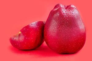 Red apples on a colored background. Selective focus. Harvesting. Healthy food. photo