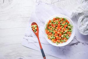 top view of corn, carrot and beans in a bowl, photo