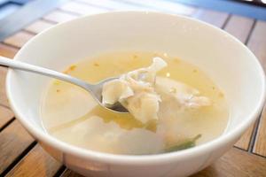 Dumpling Soup in a bowl on table, photo