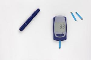 Glucometer with nine point three 9.3 mmol per liter glycemic index on display photo