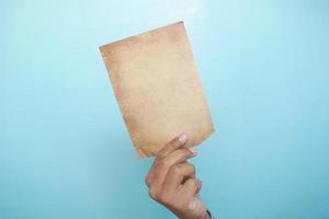 holding a vintage color paper, copy space photo