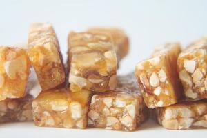 pea nuts sweet bar on white backgorund photo