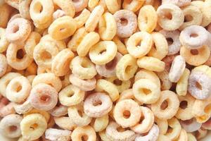 close up of colorful cereal corn flakes in a bowl photo