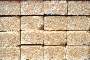 close up of brown sugar cube on table photo