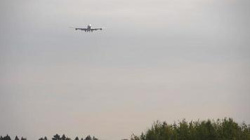 Jumbo wide body aircraft descends for landing. Cargo plane arrives at the airport video