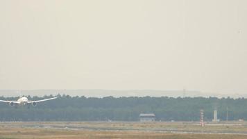 Widebody airplane lands on 7C runway of Frankfurt international airport. video