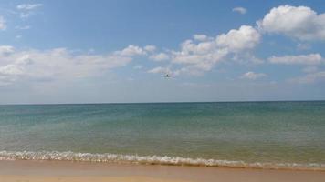 Airplane approaching over ocean before landing on the Phuket airport. Mai Khao beach video