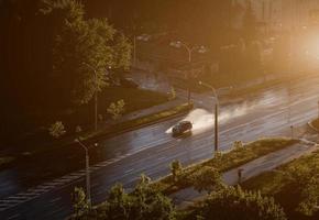 Car driving on a flooded road. photo