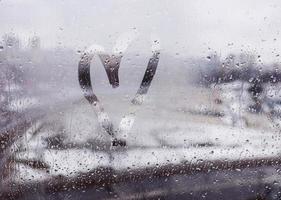 Heart sign on window. photo